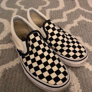 Black checkerboard slip on Vans